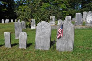 photograph of cemetery headstones.